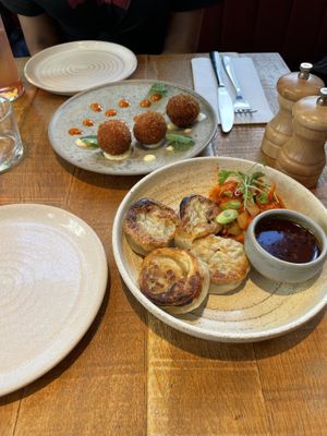 V’duja croquettes with saffron aioli and pepper ketchup on the left. Dumplings with kimchi and gochujang dip on the right.  at Mallow - Borough Market in South East London