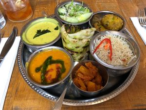 market thali: kiri hodi, gunpowder almond goji pilau, cucumber sambol, pineapple amchar, gujarati dahl, sabudana vada. flatbread at Mallow - Borough Market in South East London
