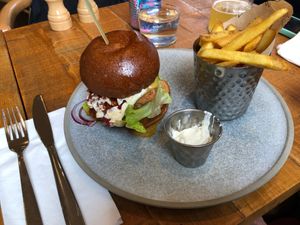 buttermilk plant chick'n, cacio e pepe mayo, peperonata relish, brioche bun, fries at Mallow - Borough Market in South East London