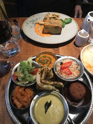 Thali in front and artichoke caponata with potato pave in back  at Mallow - Borough Market in South East London