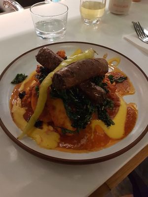 Sausages on Persian cauliflower and potatoes, with kale and apricot harissa   at Mallow - Borough Market in South East London