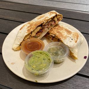 Crunch Wrap (notice some bits of food on plate)  at Guacamaya Oasis Plant Based Mexican Cuisine in Downey