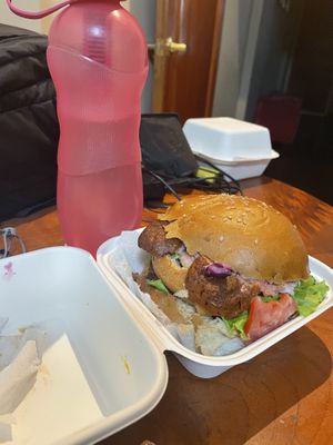 Double decker burger with sausage at Bien Plantado in Iquitos