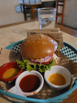 juicy burger with sauces at Bien Plantado in Iquitos