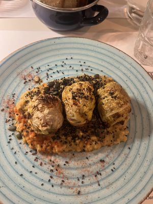 sfere di verze ripiene di patata viola e su letto di lenticchie  at La Svolta in Bologna