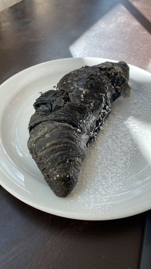 Charcoal croissant at VERA in Palermo