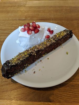 Raw chocolate-pistachio cake with coconut cream! at En Deli Haga in Gothenburg