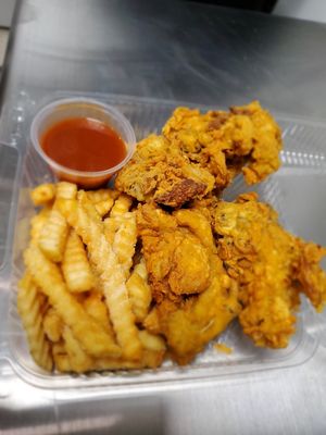 Vegan fried chicken "mushroom", seasoned fries, and in-house savory sauce at Julie's Guilt-Free Sweet Treats in Tucson