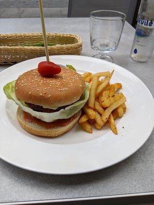 Burger with soy patty and vegan cheese (vegan) at Radharane - Gedimino in Vilnius