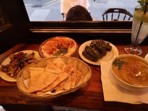 Makdous aubergine, houmous Beiruty, bread, vine leaves and lentil soup at Palmyra's Kitchen in North London