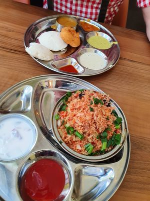 Idly, vada and sambar and Fried vegetables rice with side dishes at Saravanaa Bhavan in Berlin