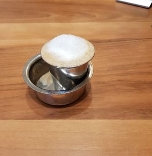 Fun fact: the coffee is to be poured into the bowl and back into the glass 2-3 times for uniform flavour at Saravanaa Bhavan in Berlin