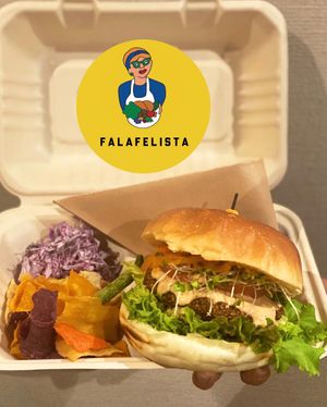 Falafel burger with some veggies and chips. Comes with vegan buns.  at Falafelista in Tokyo