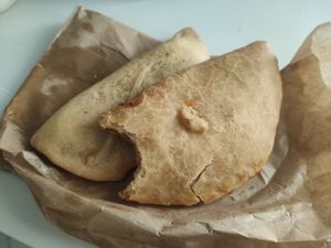 Empanadillas de calabacín y cebolla, y tomate at La Pastelería Llisó in Valencia