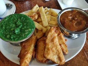 Tofish and chips with curry and mushy peas at Papa's Fish & Chips in Blackpool