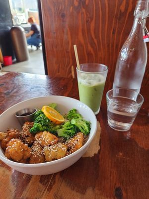 Orange chicken bowl and iced matcha latte. YUM. at Sage Bistro and KindKreme in Los Angeles
