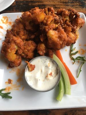 Partially eaten buffalo wings which were the best I’ve had at Sage Bistro and KindKreme in Los Angeles