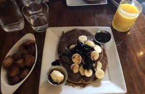 Blueberry pancakes and breakfast potatoes  at Sage Bistro and KindKreme in Los Angeles