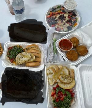 Caught them at Veg Fest in Ypsi 2023. Rosie Salad, Bruschetta as a dip with garlic bread, Arancini, Strawberry ricotta dip w/ garlic bread.   at Vegano Italiano - Food Truck in Ann Arbor