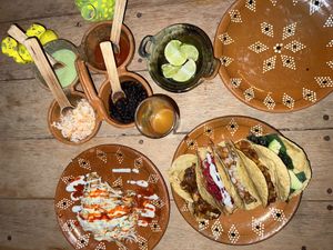 Tacos dorados and an assortment of tacos including the tofu-fish, pastor, potato mushroom, huitlacoche, and more!  at La Vegan Taqueria in Tulum