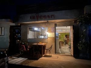 One outdoor table, 2 indoor tables, 3 barstools w/small ledge table  at La Vegan Taqueria in Tulum