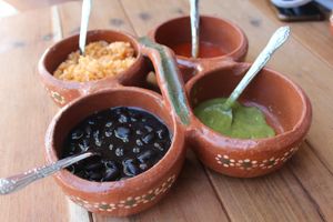 Selection of Homs made sauces and black beans   at La Vegan Taqueria in Tulum