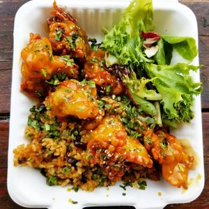 Orange tofu over rice and beans at saVor in San Juan