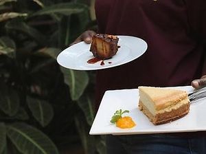 Ricotta cheesecake and a vegan, gluten free Almond and Vanilla pudding! You know you can take the whole cake home right? at Green Bean in Kampala