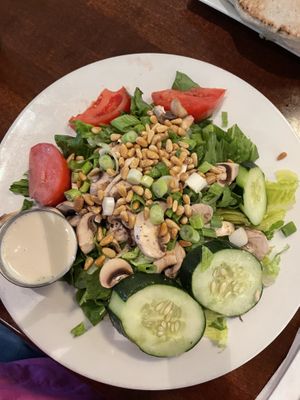 Pine nut salad with uncooked mushrooms  at Aladdin's Natural Eatery in Rochester