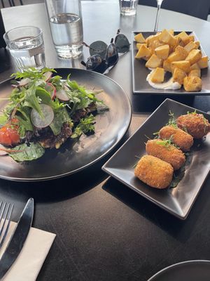 Zucchini and corn fritters, mushroom croquettes, patatas bravas at Noble Perth in Subiaco
