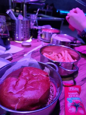 Quinoa burger with a side of fries (sans lid) at Rollercoaster in Vienna