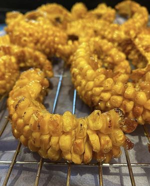 Corn ribs double fried, Negroni washed Szechuan salt, served with foraged blackberry ketchup. at Table 13 in Wheatley