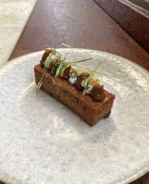Chickpea panisse, harissa, pepita pesto, pickled celery and mustard seeds. Crispy, sour, sweet, spicy, soft at heart. A banger 💥     at Table 13 in Wheatley