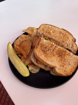 Vegan Reuben served with chips and a pickle  at Avanti in Boulder