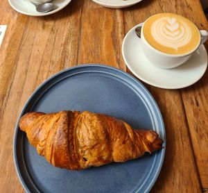 Vegan Croissant and Cappuccino with oat milk at Jonas Reindl Coffee Roaster - Cafe & Roastery in Vienna