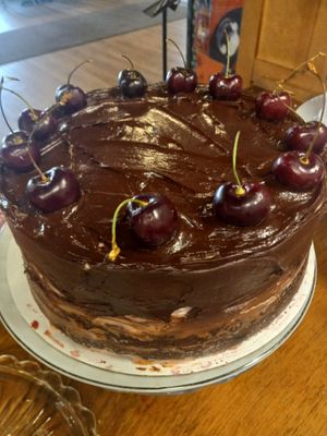 Chocolate Fudge layer cake, filled with vegan whipped cream and cherries. Covered with strawberry frosting and chocolate ganache. Vegan and gluten-free.  at Maximum Zen in Clarks Summit