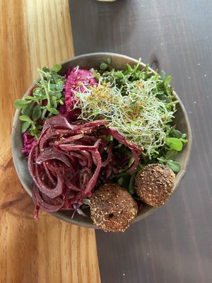 Lentil bowl with hummus sprouts beet root falafel-like balls   at Aguacate Veggie Bar in San Cristobal De Las Casas