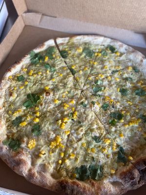 “Corny peener” NY style vegan pizza with roasted corn, cilantro, and a jalapeño sauce. Best ever  at TNT Pizza in San Diego