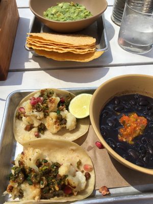 Cauliflower tacos, chips with fresh guacamole, side of black beans. at Bartaco in Boston