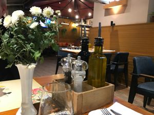 Pepper, salt, oil and vinegar at the table at The Rooms Restaurant in Tirana