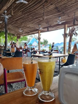 carrot juice + mango-passion smoothie at M&J Cafe  in Zanzibar
