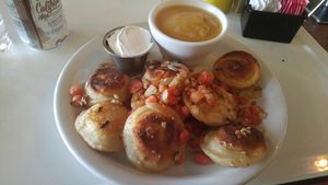 Perogis with apple sauce and vegan sour cream  at The Owlery in Bloomington