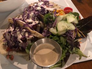 Tacos and side salad with tahini! Yum. at The Owlery in Bloomington