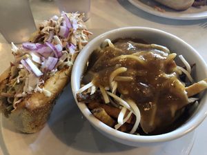 The BBQ sub with VEGAN poutine!!! at The Owlery in Bloomington