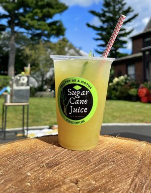 Our sugar cane is Fresh pressed on site, the only added thing is a squeeze of lime  at Healthy As A Motha Vegan Kitchen in Brooklyn