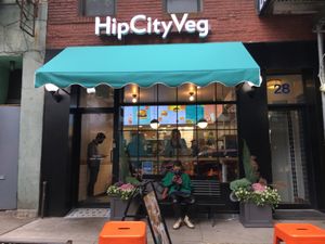 Front entrance with guy on bench (coincidentally, the same person as in one of dbader's photos is sitting in the front!). at HipCityVeg - Union Square in New York City