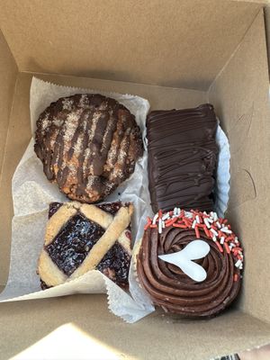 Chocolate babka, rainbow cookie mousse bar, vanilla cupcake with chocolate frosting, Linzer tart   at Pride Enjoy in Wading River