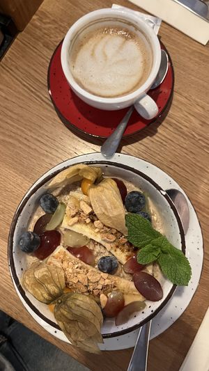 porridge + hafermilch cappucino  at Café Zehnsiebzig in Vienna