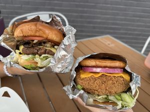 philly cheese impossible burger and spicy chicken sandwich  at Burgeezy in Indianapolis