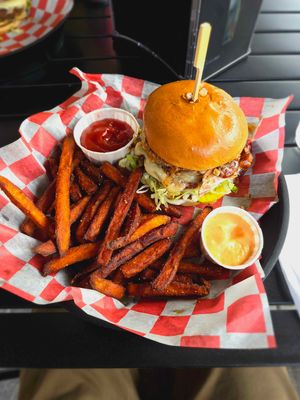 Double BBQ Bacon Burger with large sweet potato fries. Delicious! but messy and expensive.  at Burgeezy in Indianapolis